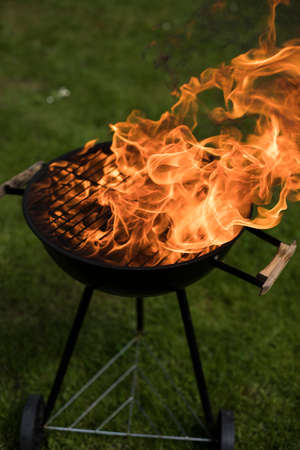 Barbecue grill with fire on nature, outdoor, close upの写真素材