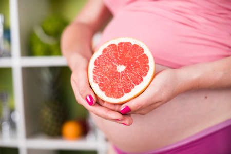 Pregnancy, healthy food and people conceptの写真素材