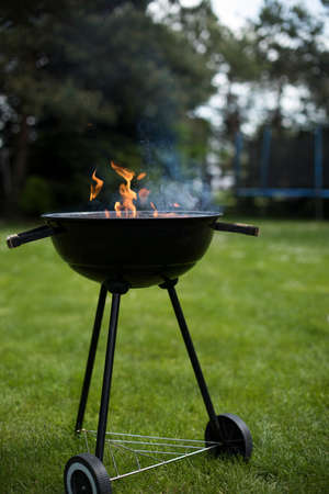 Grill on the garden, barbecue and fire backgroundの写真素材