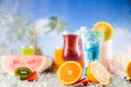 Summer drink with blur beach on backgroundの写真素材