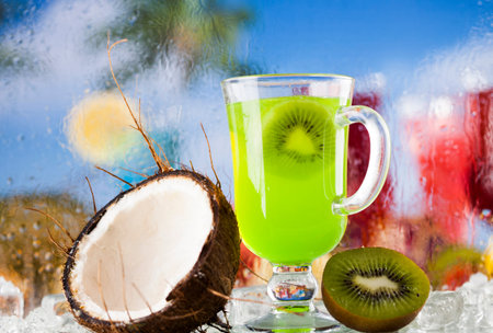 Summer drink with blur beach on backgroundの写真素材