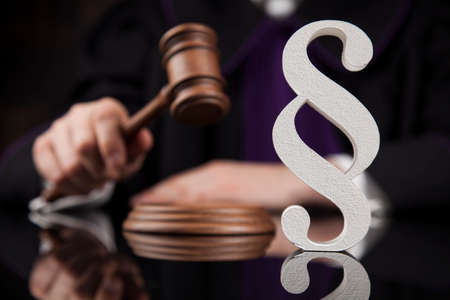 Striking mallet, Judgment concept, book background and Paragraphの写真素材