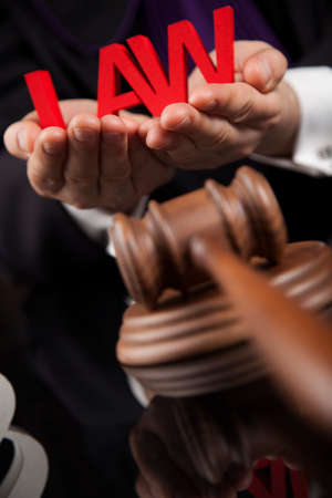 Law and justice concept, Brown wooden background, beautiful reflectionsの写真素材