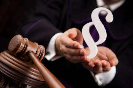 Striking mallet, Judgment concept, book background and Paragraphの写真素材