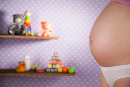 Close up of a cute pregnant bellyの写真素材