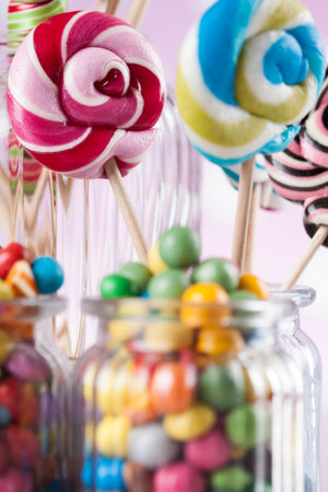 Colorful lollipops and different colored round candy and gum ballsの写真素材