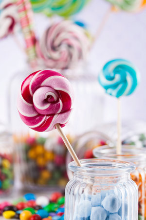 Glass jars in Colorful candies,lollipops and gum balls