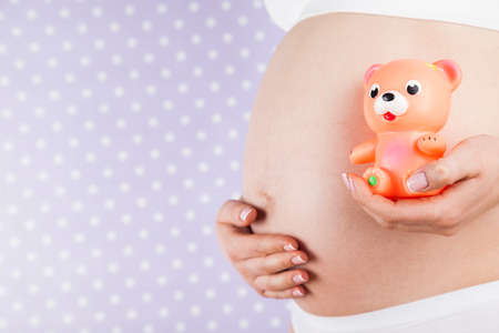 Bear and Happy pregnant womanの写真素材