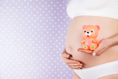 Bear and Happy pregnant womanの写真素材
