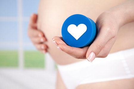Pregnant woman holding a heart