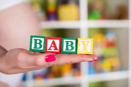 Wooden toy cubes with letters, Baby, Pregnancy conceptの写真素材