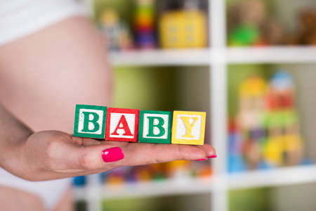 Wooden toy cubes with letters, Baby, Pregnancy conceptの写真素材