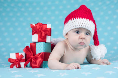 Little cute baby girl with santa hatの写真素材