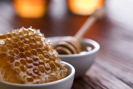 Jar full of fresh honey and honeycombsの写真素材