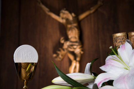 Eucharist symbol of bread and wine, chalice and host, First communion background