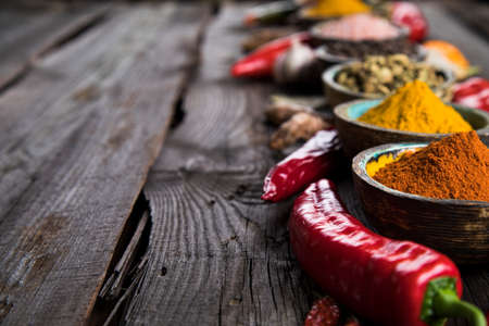 Spices on wooden bowl backgroundの写真素材