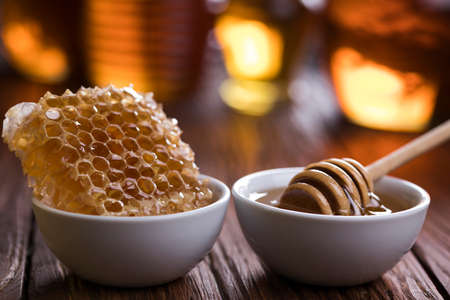 Jar full of fresh honey and honeycombsの写真素材