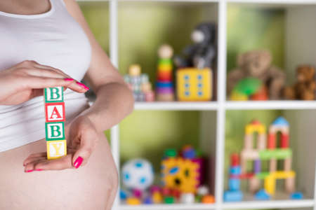 Wooden toy cubes with letters, Baby, Pregnancy conceptの写真素材