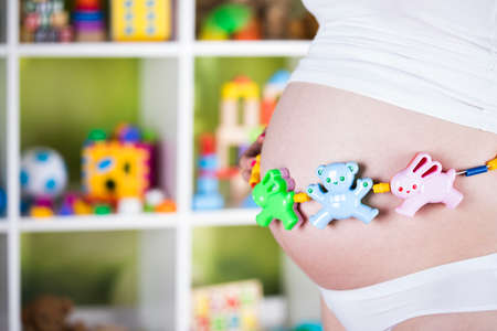 Pregnant woman with a toyの写真素材