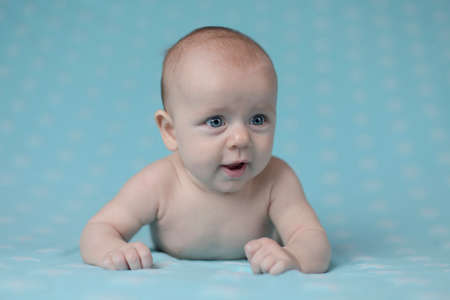 Crawling baby boyの写真素材