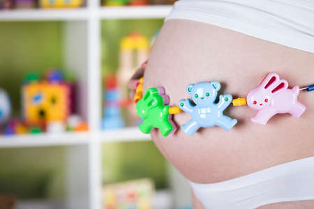 Pregnant woman with a toyの写真素材