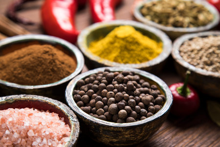 Variety of spices and herbs on kitchen table