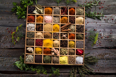 Spices in wooden box, Cooking ingredientの写真素材