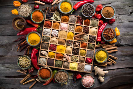 Wooden box with spices and herbsの写真素材