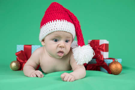 Little cute baby girl with santa hatの写真素材