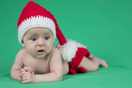 Baby in christmas hatの写真素材
