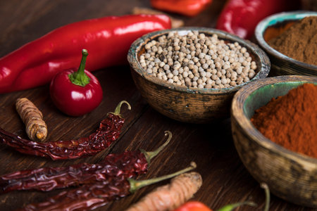 Spices and herbs in wooden bowls. Food and cuisine ingredientsの写真素材