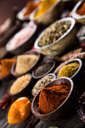Variety of spices and herbs on kitchen tableの写真素材