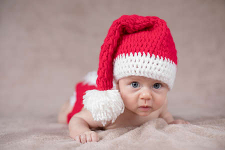 Little cute baby girl with santa hatの写真素材