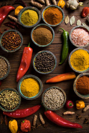 Variety of spices and herbs on kitchen tableの写真素材