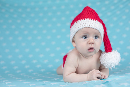 Baby in christmas hatの写真素材