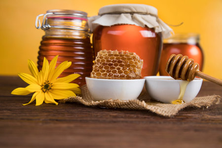 Jar full of fresh honey and honeycombs
