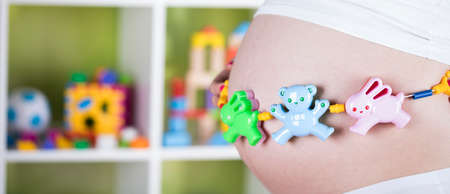 Pregnant woman with a toyの写真素材