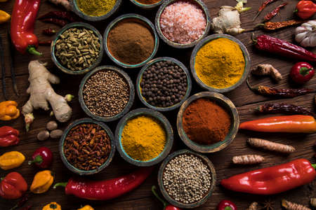 Spices and herbs in wooden bowls. Food and cuisine ingredientsの写真素材