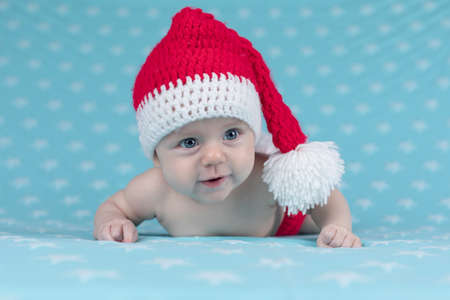 Little cute baby girl with santa hatの写真素材