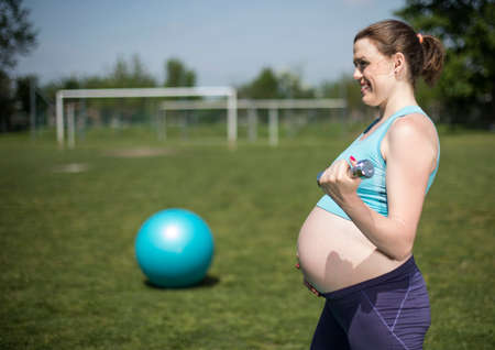 Gym fitness,Pregnant woman, healthy lifestyle conceptの写真素材