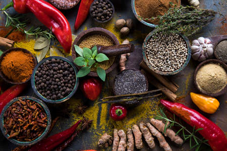 Variety of spices and herbs on kitchen tableの写真素材
