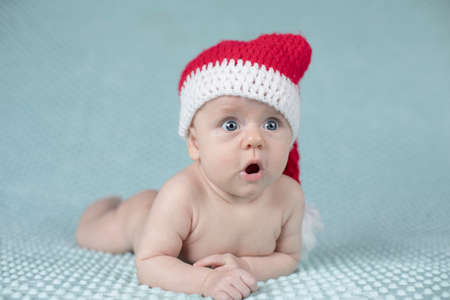 Little cute baby girl with santa hatの写真素材