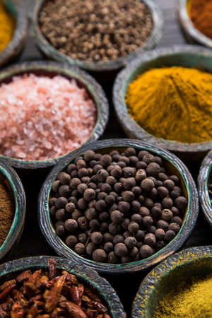 Variety of spices and herbs on kitchen tableの写真素材