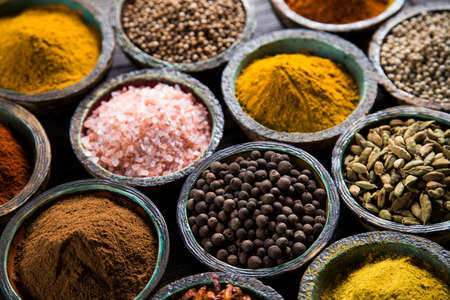Variety of spices and herbs on kitchen tableの写真素材