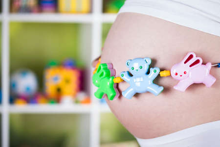 Pregnant woman with a toyの写真素材