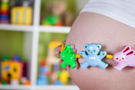 Pregnant woman with a toyの写真素材