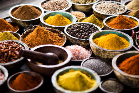 Spices and herbs in wooden bowls. Food and cuisine ingredientsの写真素材