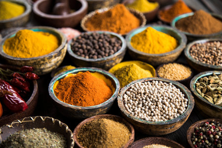 Spices on wooden bowl background