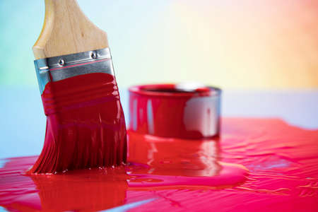 Paintbrush on cans with colorの写真素材