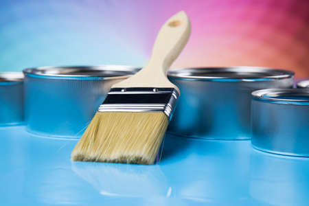 Tin cans with paint, brushes and bright palette of colorsの写真素材